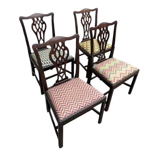 27 - A SET OF FOUR GEORGE III PERIOD MAHOGANY HEPPLEWHITE DINING CHAIR
With fretwork vase splat  backs, u... 