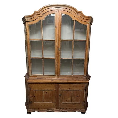 33 - A 19TH CENTURY DUTCH PINE DRESSER/DISPLAY CABINET
With domed top above two glazed doors enclosing sh... 