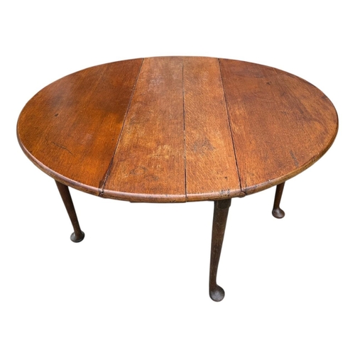 37 - A 19TH CENTURY MAHOGANY DROP LEAF TABLE
On turned legs and pad feet.

Condition: some wear and use