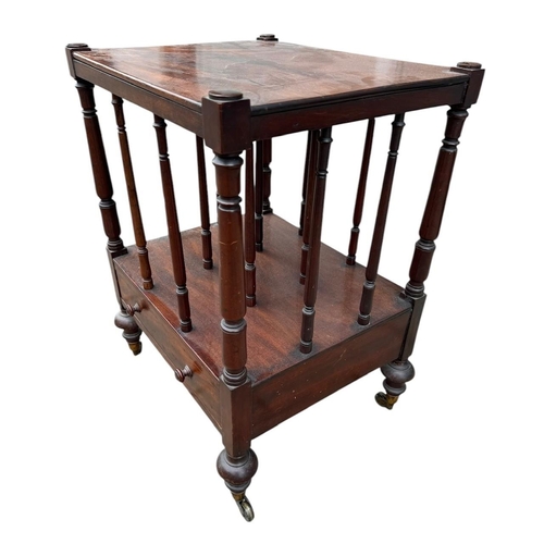 41 - A VICTORIAN MAHOGANY CANTERBURY TABLE 
With turned rails above a single drawer, on squat turned legs... 