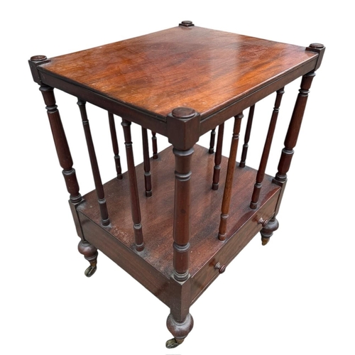 41 - A VICTORIAN MAHOGANY CANTERBURY TABLE 
With turned rails above a single drawer, on squat turned legs... 