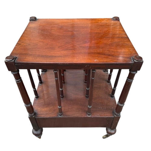 41 - A VICTORIAN MAHOGANY CANTERBURY TABLE 
With turned rails above a single drawer, on squat turned legs... 