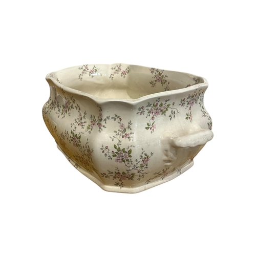 70 - A LATE 19TH/EARLY 20TH CENTURY FLORAL IRONSTONE FOOTBATH/JARDINIERE
Having two carry handles. 
(h 18... 