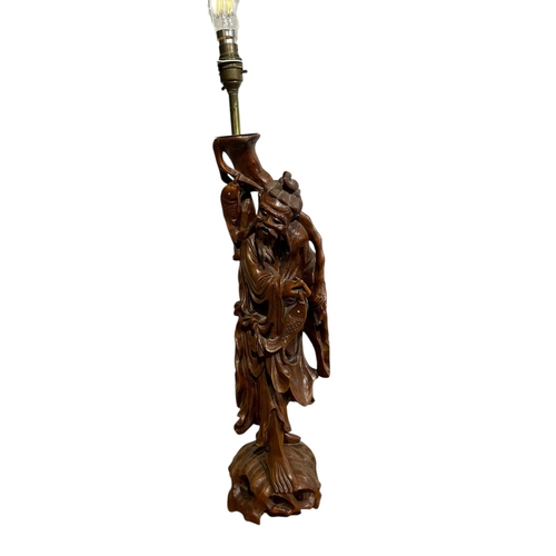 71 - A LARGE CHINESE CARVED ROOT WOOD FIGURAL LAMP
Together with a frosted glass lamp and one other. 
(Ch... 