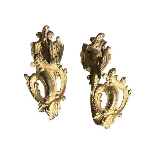 79 - SEVEN PAIRS OF 19TH CENTURY FRENCH GILT BRONZE AND ORMOLU CURTAIN TIEBACKS
Majority having impressed... 