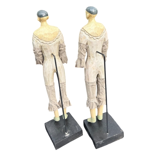 82 - A PAIR OF CARVED WOOD SANTOS FIGURES ON STANDS.
(h 40.5cm)