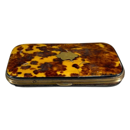 84 - A 19TH CENTURY TORTOISESHELL SPECTACLE CASE
Having yellow metal shield cartouche and blue satin line... 