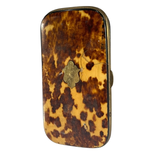 84 - A 19TH CENTURY TORTOISESHELL SPECTACLE CASE
Having yellow metal shield cartouche and blue satin line... 