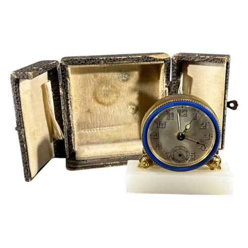 91 - BREVET, SWISS, A 20TH CENTURY ART DECO ENAMEL, ONYX AND GILT BRASS MINIATURE CLOCK
Having brushed si... 