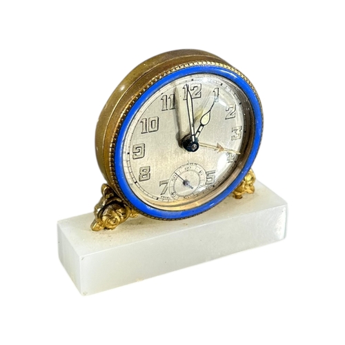 91 - BREVET, SWISS, A 20TH CENTURY ART DECO ENAMEL, ONYX AND GILT BRASS MINIATURE CLOCK
Having brushed si... 