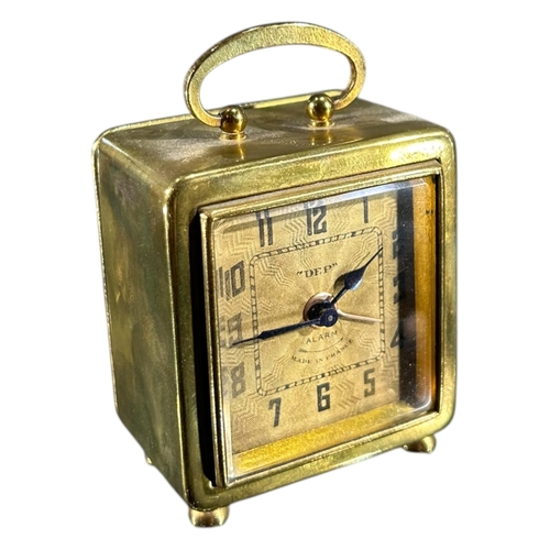 92 - A 20TH CENTURY FRENCH ART DECO MINIATURE BRASS CLOCK
Signed ‘DEP’, having stylised engine turned gil... 