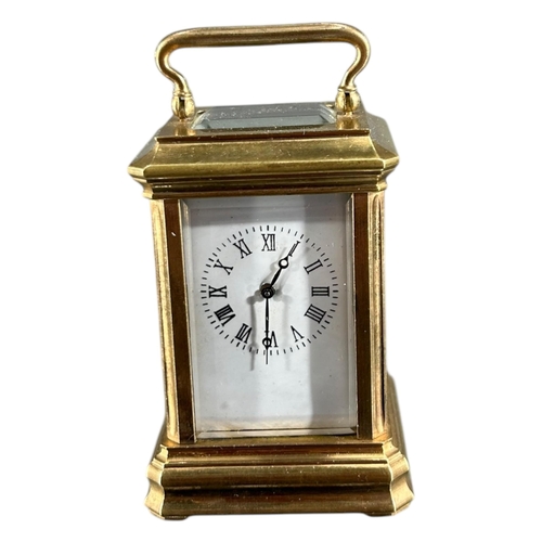 93 - A LATE 19TH/EARLY 20TH CENTURY FRENCH MINIATURE GILT BRASS CARRIAGE CLOCK
Having white enamel dial w... 