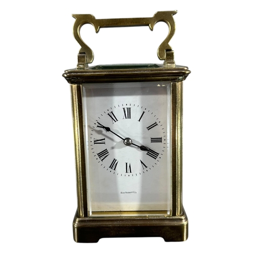 94 - SOUTHAMPTON, AN EARLY 20TH CENTURY ENGLISH GILT BRASS CARRIAGE CLOCK
Having white enamel dial with b... 