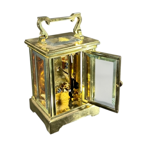 98 - TAYLOR & BLIGH, TWO 20TH CENTURY ENGLISH GILT BRASS MINIATURE CARRIAGE CLOCK
Both having white ename... 