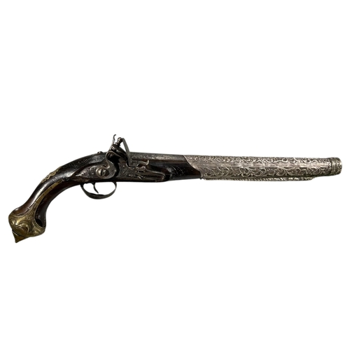 185A - AN EARLY 19TH CENTURY OTTOMAN EMPIRE TURKISH SILVER AND GILT BRASS FLINTLOCK PISTOL
Having chased an... 