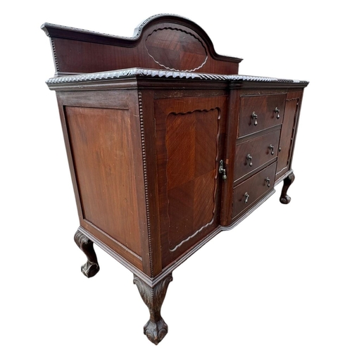 46 - AN EARLY 20TH CENTURY CARVED MAHOGANY CHIPPENDALE REVIVAL DINING ROOM SUITE
To include a set of eigh... 