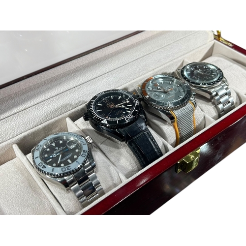 170A - A COLLECTION OF FOUR GENTLEMAN’S FASHION WATCHES, HOUSED IN MODERN WATCH DISPLAY CASE
All having sty... 