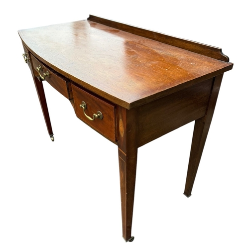 3A - A 19TH CENTURY MAHOGANY AND SHELL INLAY BOW FRONT SIDE TABLE
With three drawers, raised on square ta... 