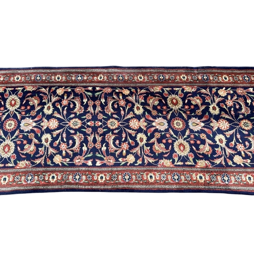 11A - A 20TH CENTURY FLORAL RUNNER/CARPET (PROBABLY TABRIZ).
(320cm x 76cm)