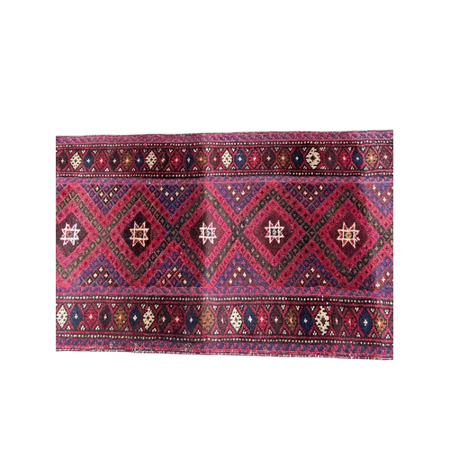 13A - A 20TH CENTURY RED GROUND RUNNER (PROBABLY LORI GABBEH).
(275cm x 58cm)