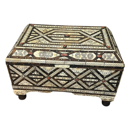 148A - A LARGE 20TH CENTURY MOROCCAN CHEST/TRUNK
Having camel bone and coral inserts, two carrying handles,... 