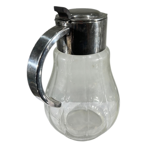 150A - A LARGE 20TH CENTURY SILVER PLATED AND GLASS WATER WATER EWER/JUG.
(h 29cm x w 21cm x d 17.5cm)