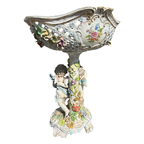 108 - CARL THIEME, A LATE 19TH CENTURY PORCELAIN CENTREPIECE
Decorated with two cherubs with various flora... 