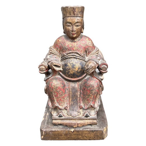 122A - A LARGE CHINESE CARVED WOOD AND POLYCHROME PAINTED FIGURES OF A SEATED EMPEROR ON THRONE
Traces of g... 