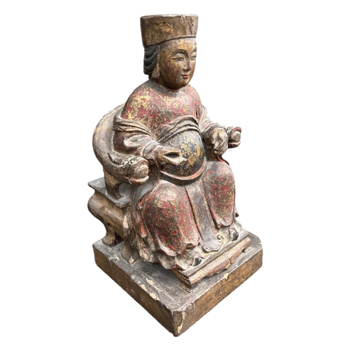 122A - A LARGE CHINESE CARVED WOOD AND POLYCHROME PAINTED FIGURES OF A SEATED EMPEROR ON THRONE
Traces of g... 