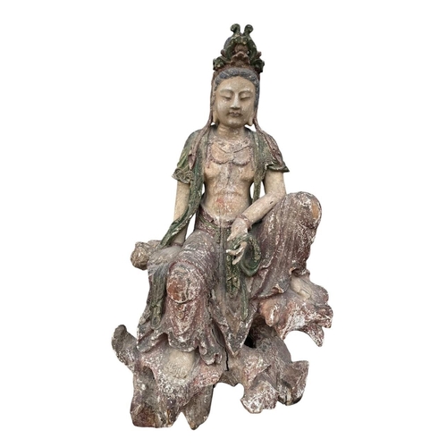 400 - A LARGE AND IMPRESSIVE CHINESE MING DYNASTY POLYCHROME-PAINTED CARVED WOOD FIGURE OF GUANYIN
The bod... 