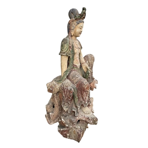 400 - A LARGE AND IMPRESSIVE CHINESE MING DYNASTY POLYCHROME-PAINTED CARVED WOOD FIGURE OF GUANYIN
The bod... 