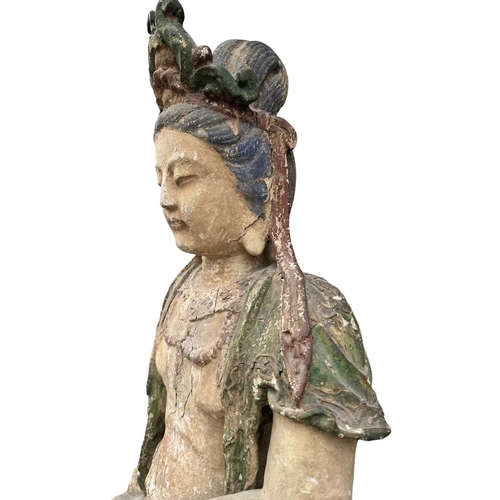 400 - A LARGE AND IMPRESSIVE CHINESE MING DYNASTY POLYCHROME-PAINTED CARVED WOOD FIGURE OF GUANYIN
The bod... 