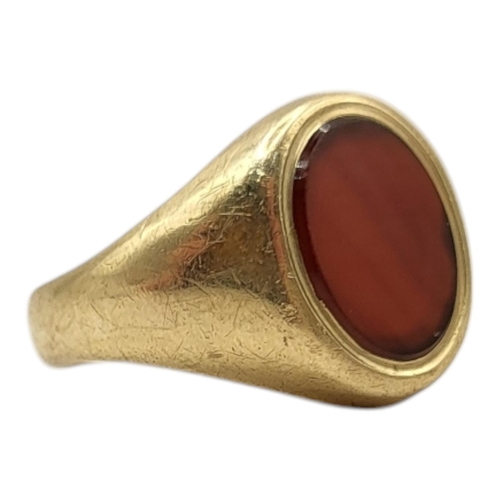 106 - A 9CT GOLD AND CARNELIAN GENTLEMAN’S SIGNET RING, CIRCA 1970
Having central flat oval cut carnelian ... 