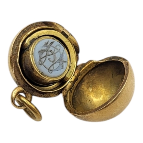 120 - UNUSUAL 19TH CENTURY YELLOW METAL BALL LOCKET WITH SWIVEL FOB/SEAL (YELLOW METAL TESTED AS 14CT GOLD... 