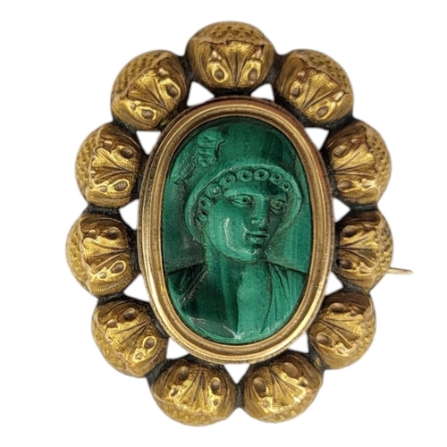 132 - A 19TH CENTURY VICTORIAN YELLOW METAL AND CARVED MALACHITE CAMEO BROOCH DEPICTING BUST OF HERMES/MER... 