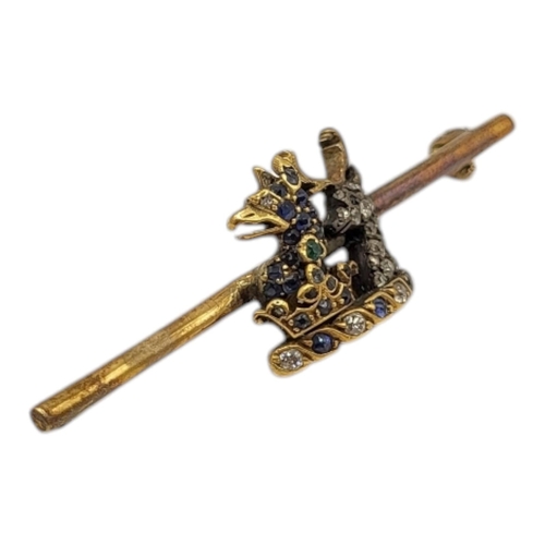 162 - A 19TH CENTURY VICTORIAN YELLOW METAL, DIAMOND AND SAPPHIRE ENCRUSTED GRIFFINS AND STAG HEAD BAR BRO... 