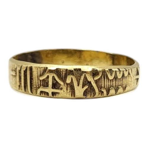 20 - AN UNUSUAL 20TH CENTURY YELLOW METAL RUNIC SCRIPT RING (YELLOW METAL TESTED AS 14CT GOLD)
Having cha... 