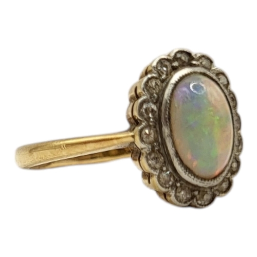 24 - AN ART DECO PERIOD YELLOW METAL, OPAL AND DIAMOND CLUSTER RING (YELLOW METAL TESTED AS 18CT GOLD)
Ha... 