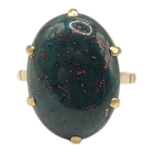 28 - A LATE VICTORIAN/EARLY EDWARDIAN YELLOW METAL AND BLOODSTONE RING (YELLOW METAL TESTED AS 14CT GOLD)... 