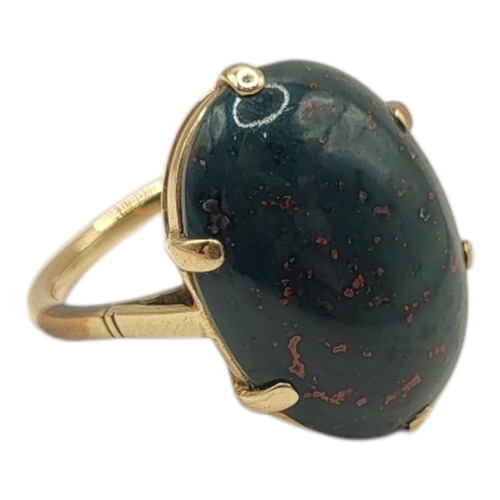 28 - A LATE VICTORIAN/EARLY EDWARDIAN YELLOW METAL AND BLOODSTONE RING (YELLOW METAL TESTED AS 14CT GOLD)... 