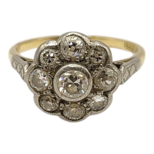 4 - AN EDWARDIAN 18CT GOLD AND PLATINUM DIAMOND CLUSTER RING
Having central round brilliant cut diamond ... 