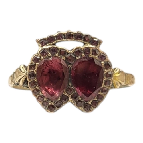 54 - GEORGIAN YELLOW METAL, GARNET & AMETHYST DOUBLE HEART RING (YELLOW METAL TESTED AS 9CT GOLD)
Having ... 