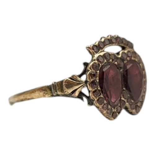 54 - GEORGIAN YELLOW METAL, GARNET & AMETHYST DOUBLE HEART RING (YELLOW METAL TESTED AS 9CT GOLD)
Having ... 