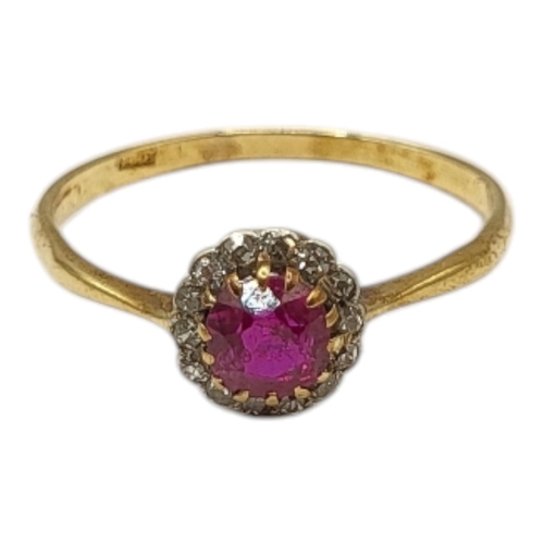 56 - AN EDWARDIAN 18CT YELLOW GOLD, RUBY AND DIAMOND RING
Having central round cut ruby (approx. 5mm) sur... 