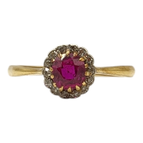 56 - AN EDWARDIAN 18CT YELLOW GOLD, RUBY AND DIAMOND RING
Having central round cut ruby (approx. 5mm) sur... 