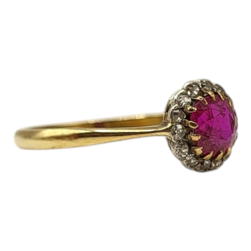 56 - AN EDWARDIAN 18CT YELLOW GOLD, RUBY AND DIAMOND RING
Having central round cut ruby (approx. 5mm) sur... 