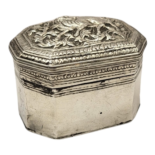 57 - A LATE 19TH/EARLY 20TH CENTURY BURMESE SILVER BETEL BOX
Rectangular form with chamfered corners, eng... 