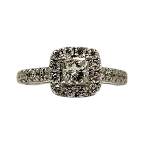 72 - A 14CT WHITE GOLD AND DIAMOND CLUSTER RING
Having central princess cut diamond (approx. 4mm x 4mm) s... 