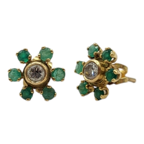 74 - A PAIR OF YELLOW METAL, DIAMOND AND EMERALD EARRINGS (YELLOW METAL TESTED AS 18CT GOLD)
Both having ... 