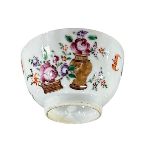 394 - A CHINESE QING DYNASTY FAMILLE ROSE PORCELAIN TEA BOWL AND SAUCER
Decorated with floral sprays and w... 